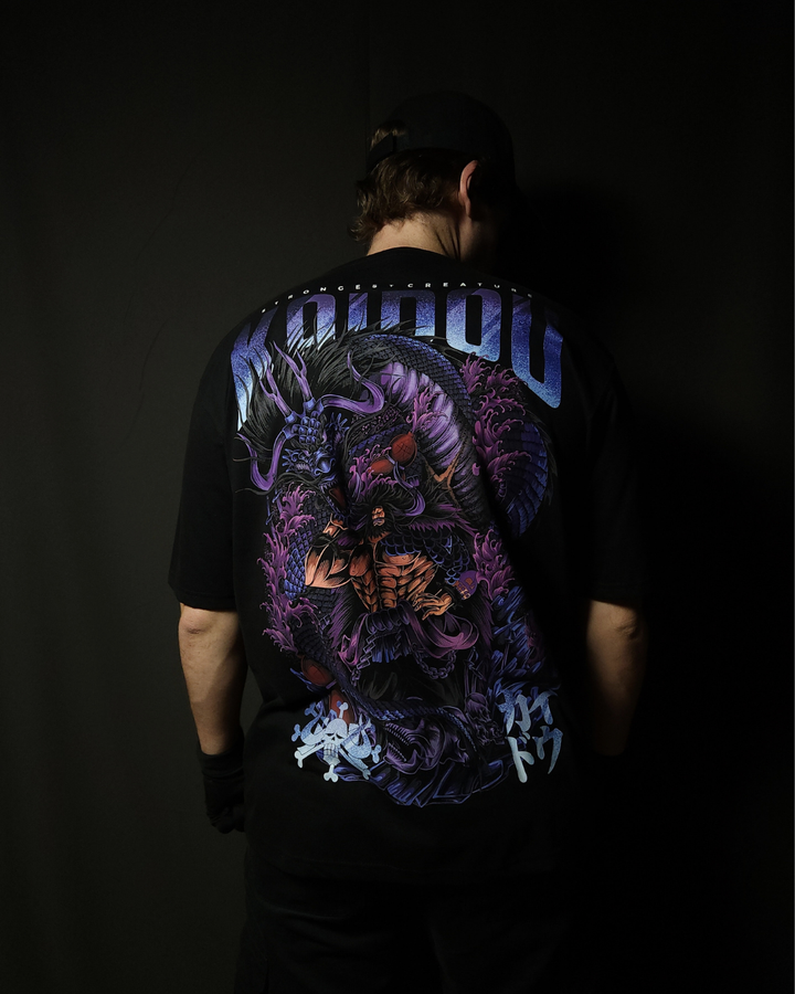 Anime-inspired apparel featuring bold back artwork, worn by a model in a dark studio setting – from a South African anime clothing brand.