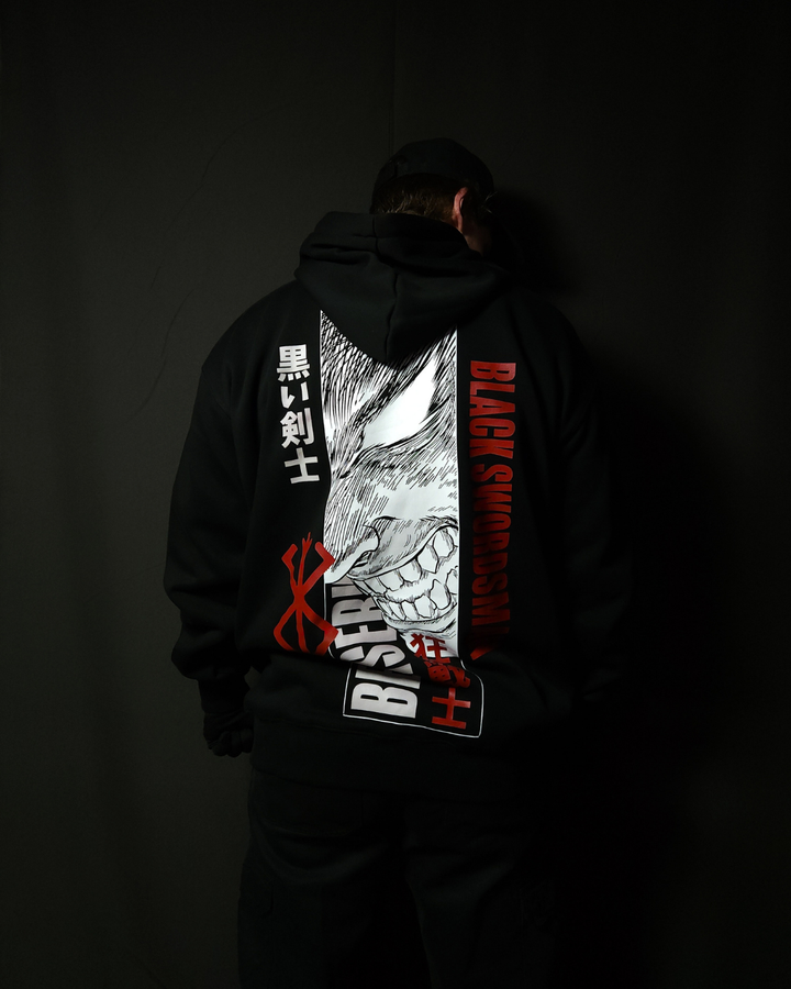Anime-inspired apparel featuring bold back artwork, worn by a model in a dark studio setting – from a South African anime clothing brand.