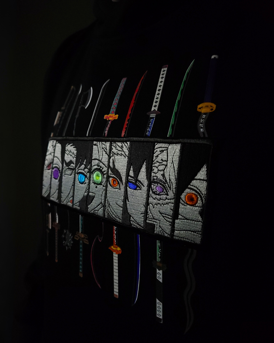 Anime-inspired apparel featuring bold back artwork, worn by a model in a dark studio setting – from a South African anime clothing brand.