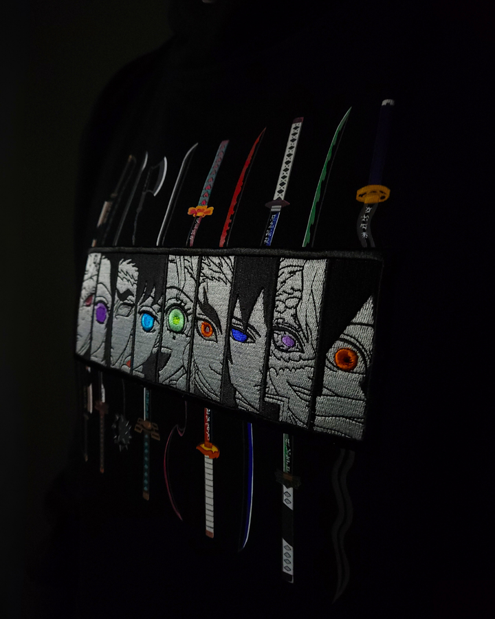 Anime-inspired apparel featuring bold back artwork, worn by a model in a dark studio setting – from a South African anime clothing brand.