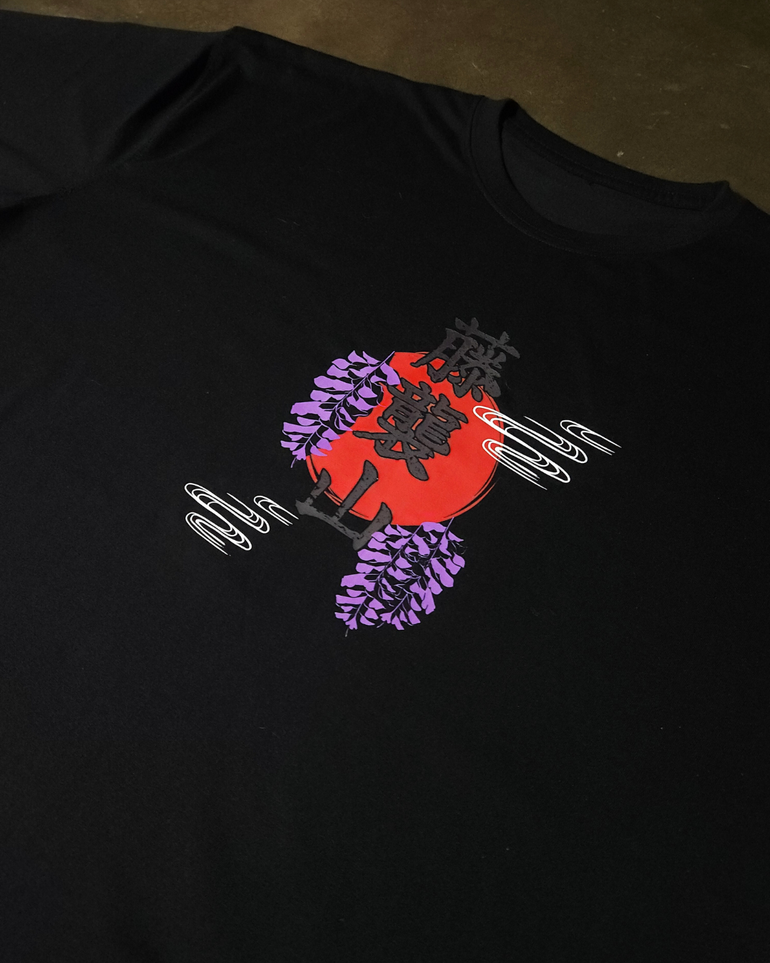 Anime-inspired apparel featuring bold back artwork, worn by a model in a dark studio setting – from a South African anime clothing brand.