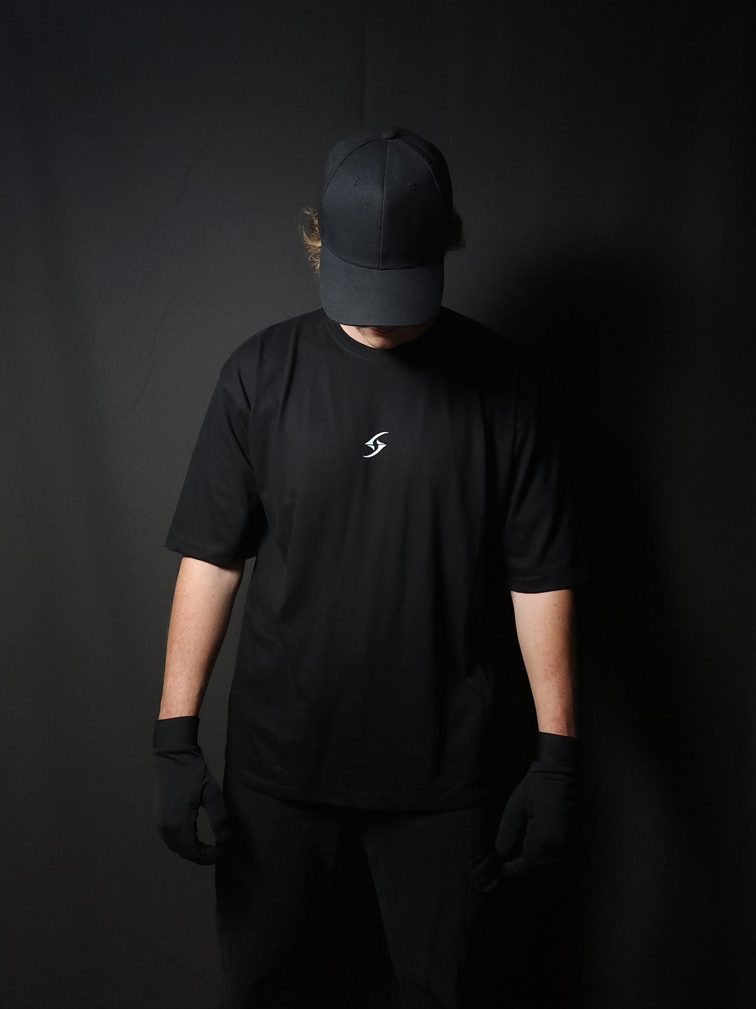 Anime-inspired apparel featuring bold back artwork, worn by a model in a dark studio setting – from a South African anime clothing brand.