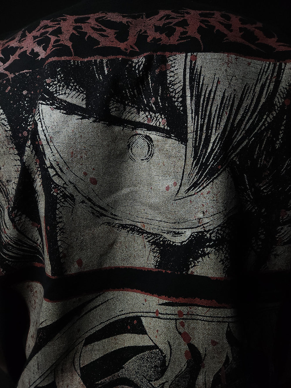 Anime-inspired apparel featuring bold back artwork, worn by a model in a dark studio setting – from a South African anime clothing brand.