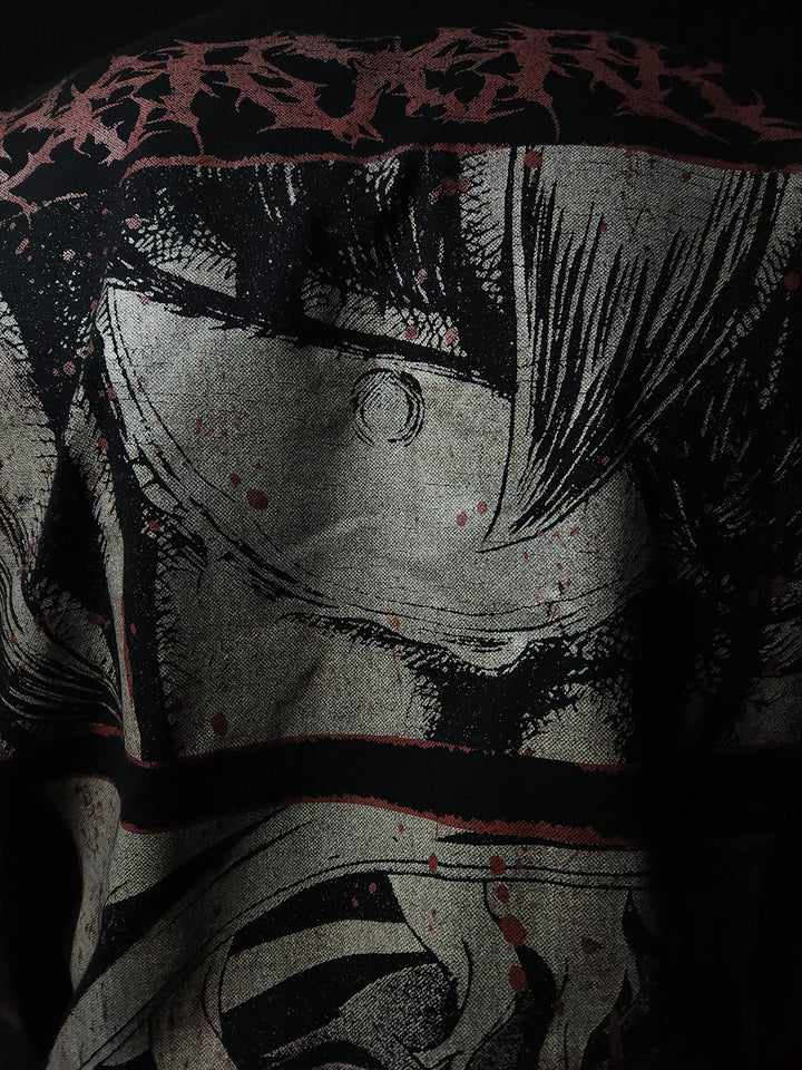 Anime-inspired apparel featuring bold back artwork, worn by a model in a dark studio setting – from a South African anime clothing brand.