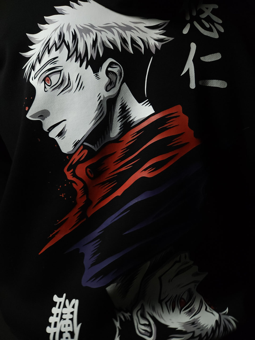 Anime-inspired apparel featuring bold back artwork, worn by a model in a dark studio setting – from a South African anime clothing brand.