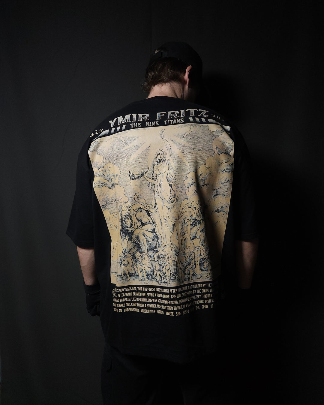 Anime-inspired apparel featuring bold back artwork, worn by a model in a dark studio setting – from a South African anime clothing brand.