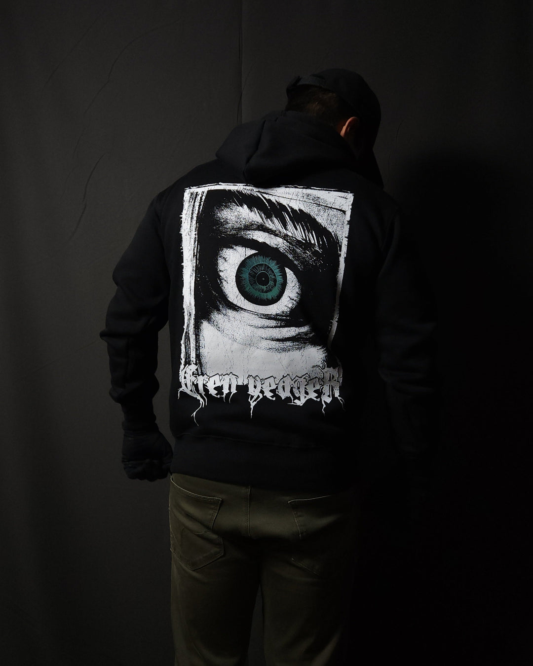 Anime-inspired apparel featuring bold back artwork, worn by a model in a dark studio setting – from a South African anime clothing brand.