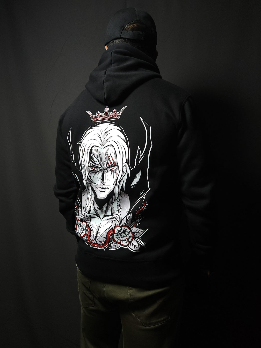 Anime-inspired apparel featuring bold back artwork, worn by a model in a dark studio setting – from a South African anime clothing brand.