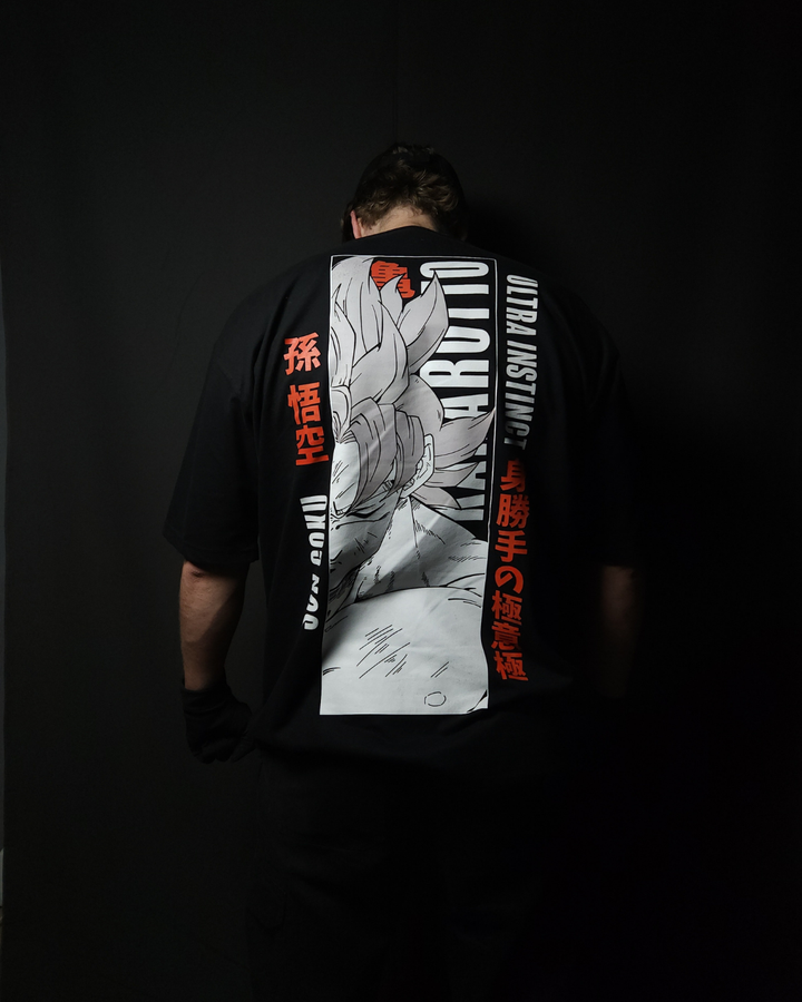 Anime-inspired apparel featuring bold back artwork, worn by a model in a dark studio setting – from a South African anime clothing brand.