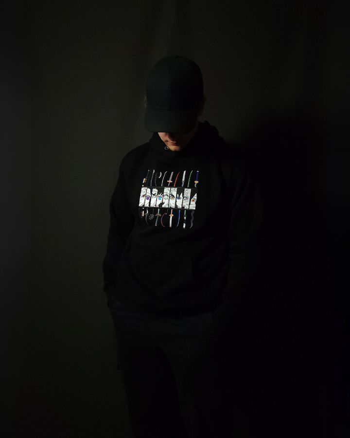 Anime-inspired apparel featuring bold back artwork, worn by a model in a dark studio setting – from a South African anime clothing brand.