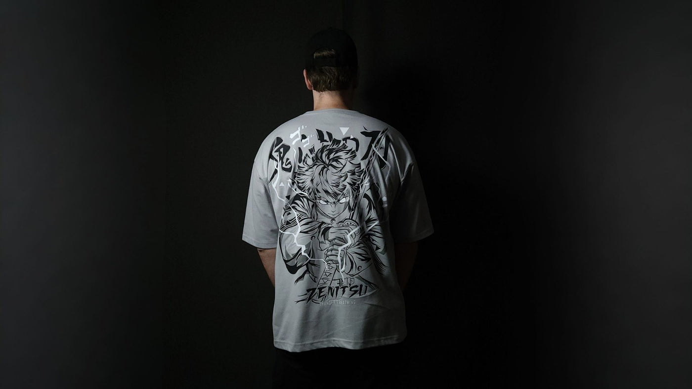 Anime-inspired apparel featuring bold back artwork, worn by a model in a dark studio setting – from a South African anime clothing brand.